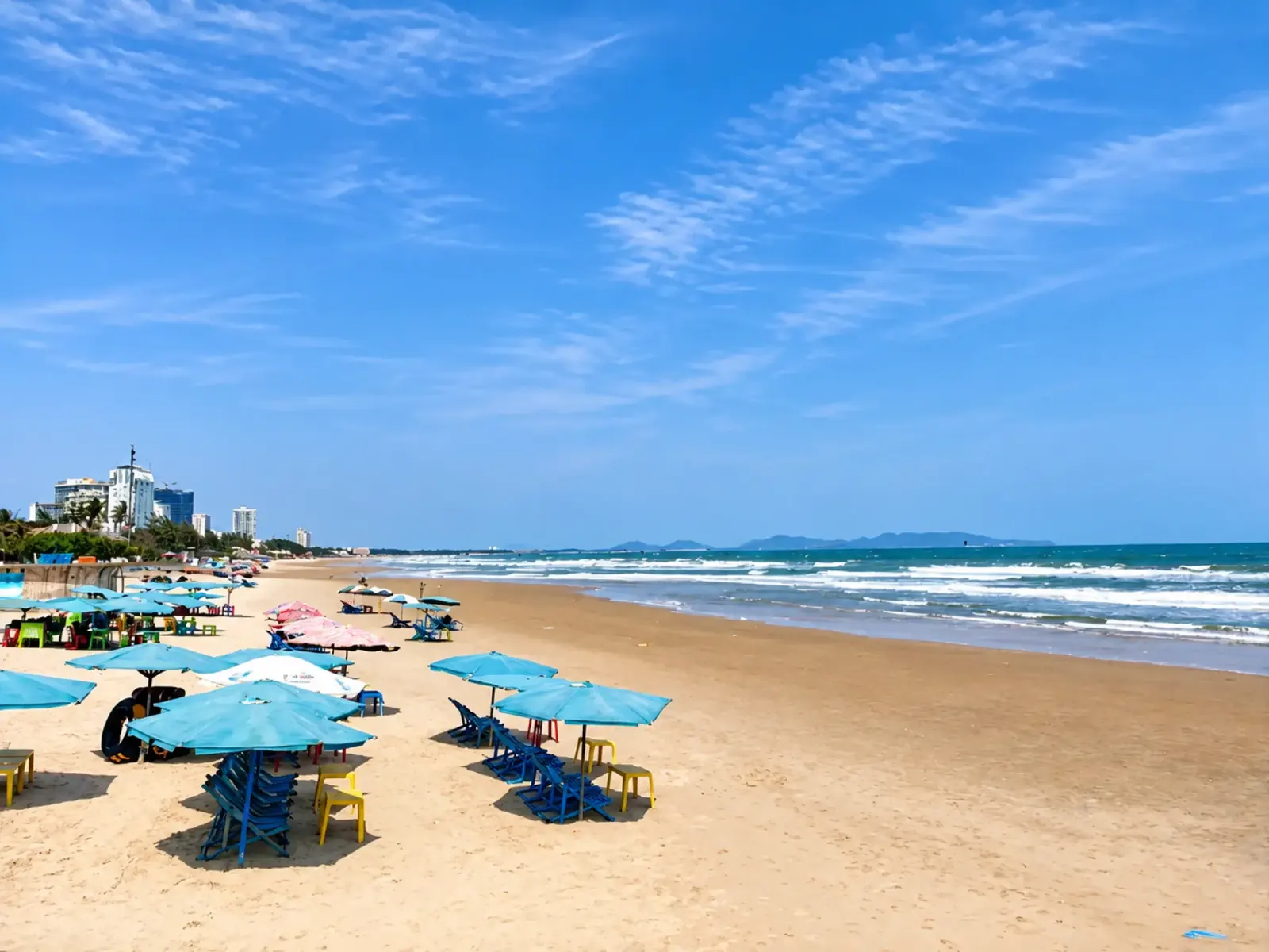 Back Beach in Vũng Tàu with beach umbrellas and a wide sandy shoreline